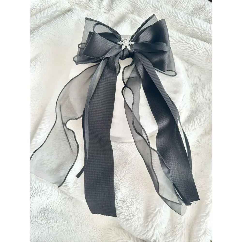 Black ribbon hair bow with snowflake charm
